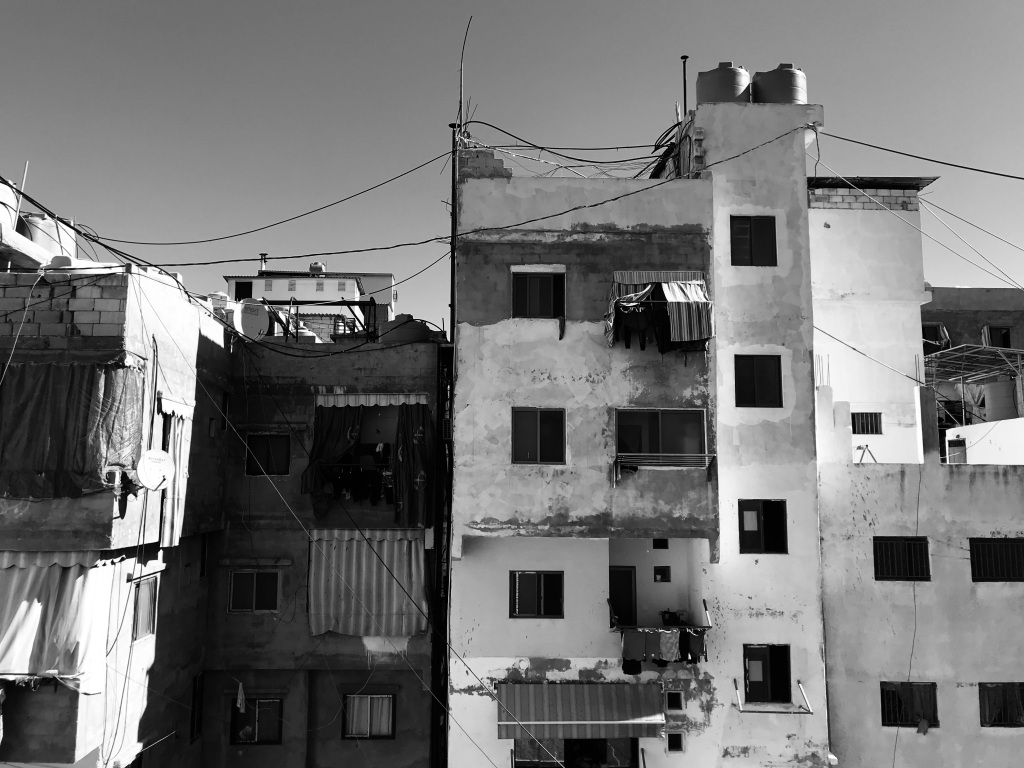 Black and white photo of buildings in the Shatila camp in Beirut.
